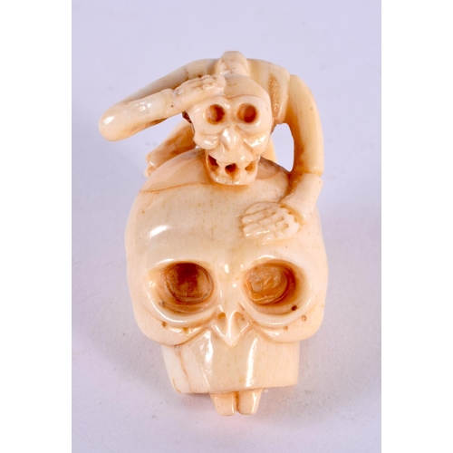 2328 - A JAPANESE CARVED BONE SKULL NETSUKE. 5 cm x 3.5 cm.