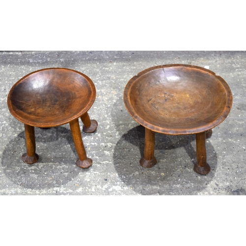 3487 - Two carved  tribal  wooden stools26 x 37 cm.(2).