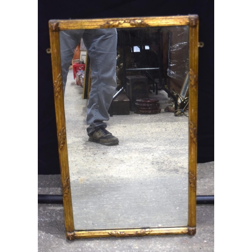 3489 - An antique gilt wood over mantle mirror 76 x 46 cm.