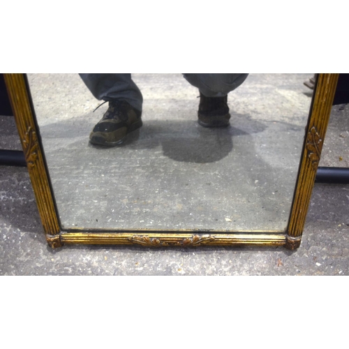 3489 - An antique gilt wood over mantle mirror 76 x 46 cm.