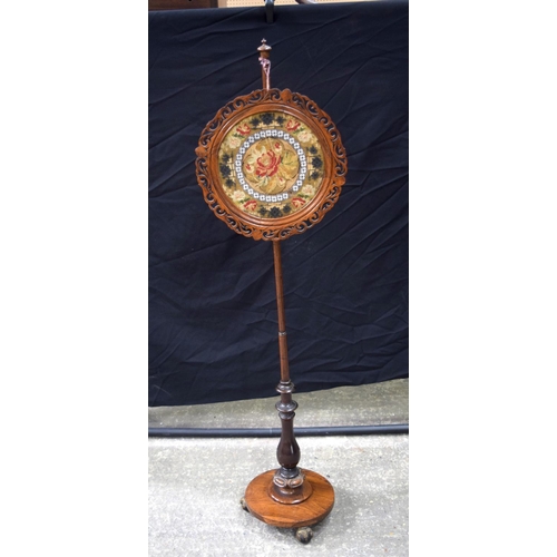 3492 - A Victorian carved wood pole screen  140 x 38 cm .