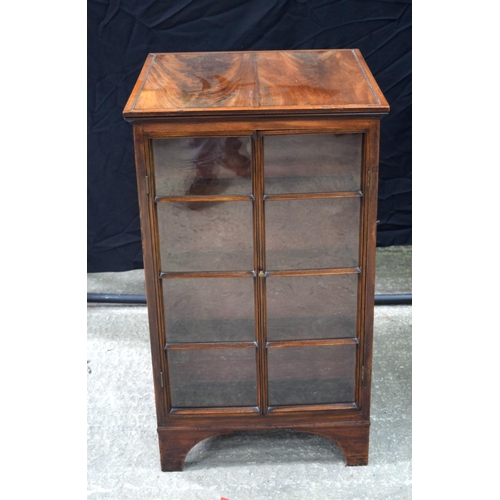 3493 - A mahogany four sided glass fronted book case 91 x 54 x 54 cm.