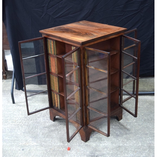 3493 - A mahogany four sided glass fronted book case 91 x 54 x 54 cm.