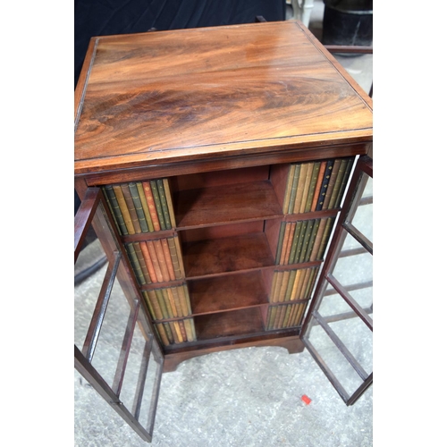 3493 - A mahogany four sided glass fronted book case 91 x 54 x 54 cm.