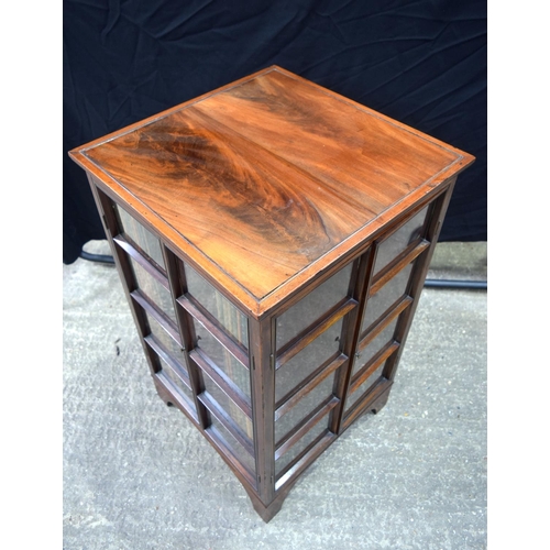 3493 - A mahogany four sided glass fronted book case 91 x 54 x 54 cm.