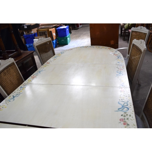 3504 - A hand painted extending dining table with 8 bergère style upholstered chairs previously in residenc... 