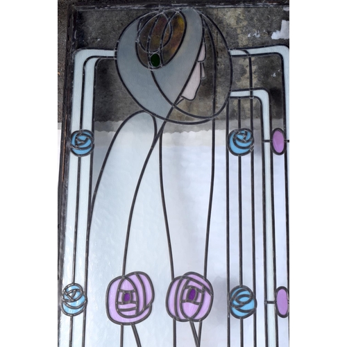 3828 - An Art Nouveau pair of stained glass leaded panels. 109 x 41cm (2).