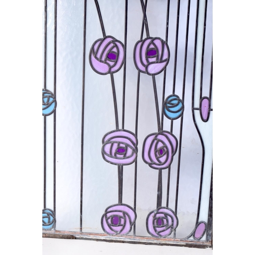 3828 - An Art Nouveau pair of stained glass leaded panels. 109 x 41cm (2).