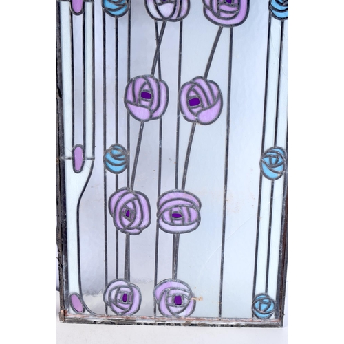 3828 - An Art Nouveau pair of stained glass leaded panels. 109 x 41cm (2).