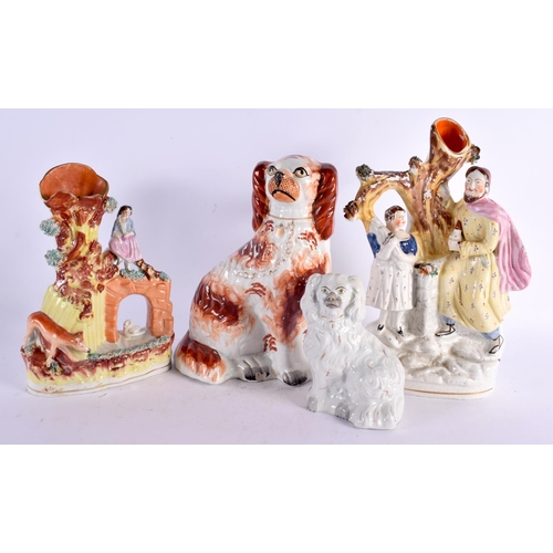 11 - FOUR 19TH CENTURY STAFFORDSHIRE FIGURES including a large spaniel. Largest 28 cm x 15 cm. (4)