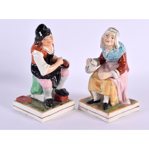 111 - A PAIR OF ANTIQUE CONTINENTAL STAFFORDSHIRE STYLE FIGURES. 17 cm high.