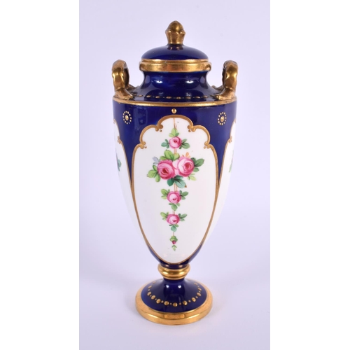 117 - A SMALL MINTONS PORCELAIN VASE AND COVER painted with flowers. 15 cm high.