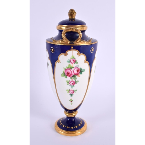 117 - A SMALL MINTONS PORCELAIN VASE AND COVER painted with flowers. 15 cm high.