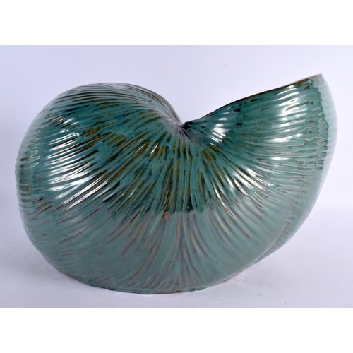 12 - A LARGE AND UNUSUAL GREEN GLAZED POTTERY NAUTILLUS SHELL PLANTER of naturalistic form. 40 cm x 27 cm... 