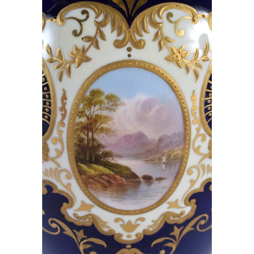 121 - A LARGE ANTIQUE COALPORT TWIN HANDLED PORCELAIN VASE painted with landscapes. 30 cm high.