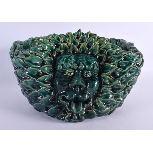 125 - A STUDIO POTTERY LION HEAD GROTESQUE POTTERY PLANTER. 24 cm x 12 cm.