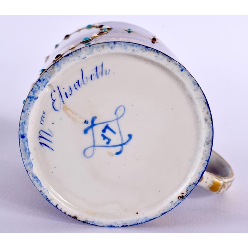 145 - A 19TH CENTURY SEVRES PORCELAIN CABINET CUP AND SAUCER jewelled with turquoise. 12 cm diameter. (2)