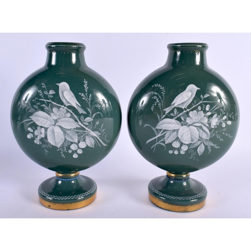 156 - A PAIR OF 19TH CENTURY ENGLISH AESTHETIC MOVEMENT GLASS MOON FLASKS enamelled with birds amongst fol... 