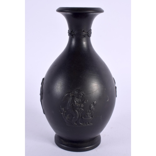 158 - AN ANTIQUE WEDGWOOD BLACK BASALT PORCELAIN VASE decorated in relief with figures. 12 cm high.