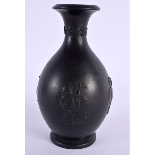 158 - AN ANTIQUE WEDGWOOD BLACK BASALT PORCELAIN VASE decorated in relief with figures. 12 cm high.