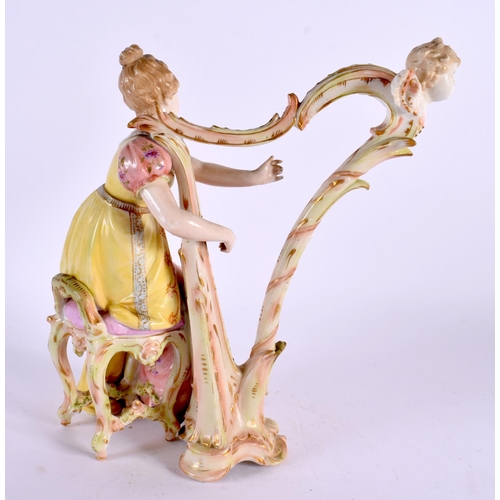 164 - A CONTINENTAL PORCELAIN FIGURE OF A GIRL AND HARP. 22 cm x 14 cm.