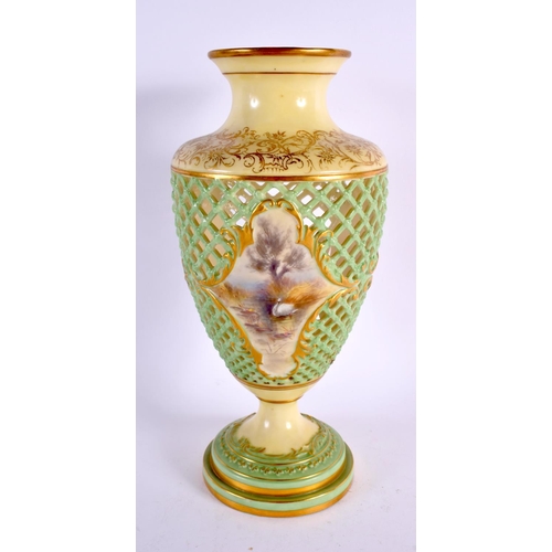 165 - A ROYAL WORCESTER RETICULATED PORCELAIN VASE painted with landscapes. 25 cm high.