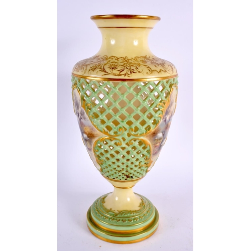 165 - A ROYAL WORCESTER RETICULATED PORCELAIN VASE painted with landscapes. 25 cm high.