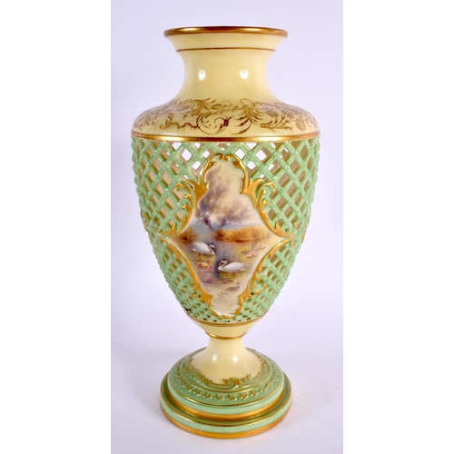 165 - A ROYAL WORCESTER RETICULATED PORCELAIN VASE painted with landscapes. 25 cm high.