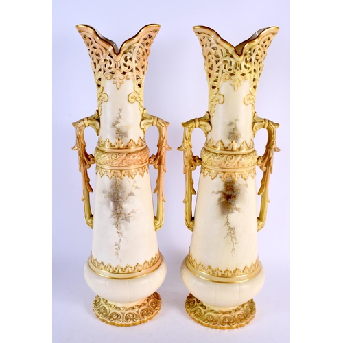 183 - A LARGE PAIR OF ROYAL WORCESTER BLUSH IVORY RETICULATED VASES painted with cattle in landscapes. 42 ... 