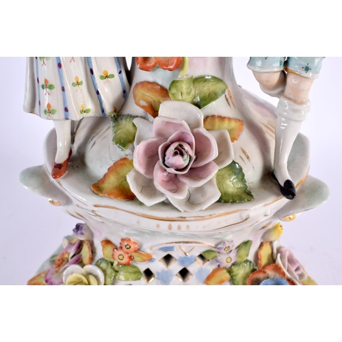 185 - A LARGE ANTIQUE GERMAN PORCELAIN CENTREPIECE formed with figures beside foliage. 44 cm x 20 cm.