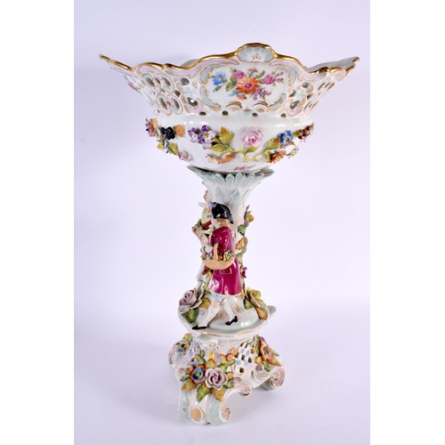 185 - A LARGE ANTIQUE GERMAN PORCELAIN CENTREPIECE formed with figures beside foliage. 44 cm x 20 cm.