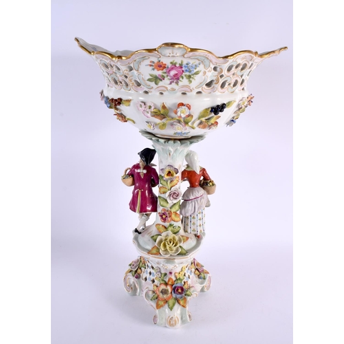 185 - A LARGE ANTIQUE GERMAN PORCELAIN CENTREPIECE formed with figures beside foliage. 44 cm x 20 cm.