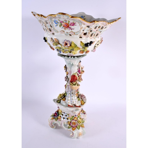 185 - A LARGE ANTIQUE GERMAN PORCELAIN CENTREPIECE formed with figures beside foliage. 44 cm x 20 cm.