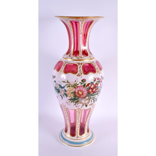 186 - A VERY LARGE 19TH CENTURY BOHEMIAN RUBY AND WHITE OVERLAID GLASS VASE painted with bold foliage. 52 ... 