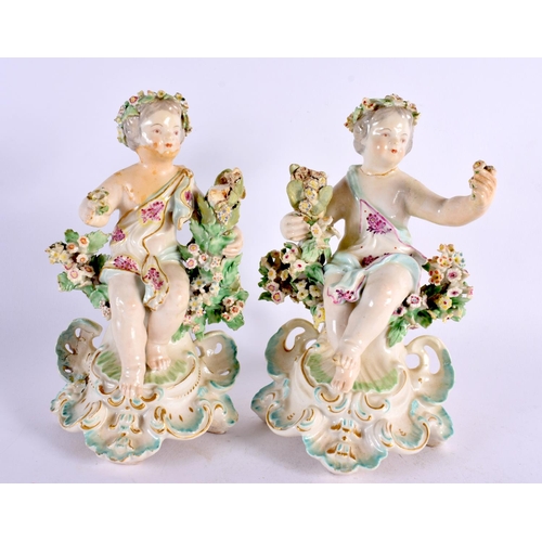 189 - A PAIR OF 18TH CENTURY DERBY PORCELAIN FIGURES OF PUTTI modelled seated upon floral encrusted seats.... 