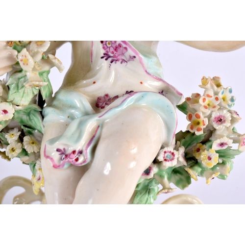 189 - A PAIR OF 18TH CENTURY DERBY PORCELAIN FIGURES OF PUTTI modelled seated upon floral encrusted seats.... 