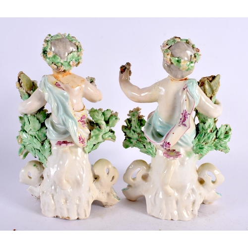 189 - A PAIR OF 18TH CENTURY DERBY PORCELAIN FIGURES OF PUTTI modelled seated upon floral encrusted seats.... 