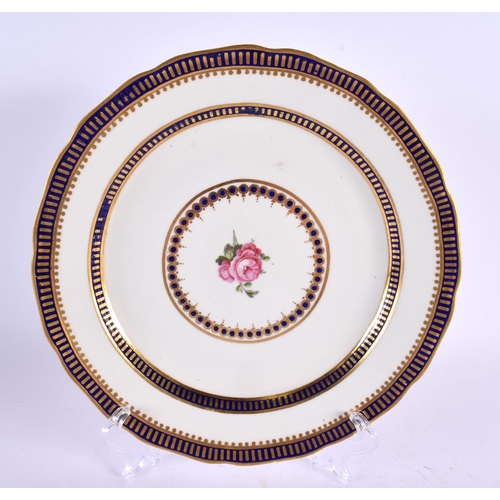 195 - 18th century puce mark plate painted with a central rose surrounded by borders of gold and cobalt bl... 