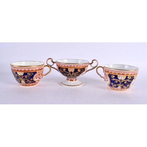 206 - Early 19th century Spode two handled pedestal cup with welled saucer and two Spode cups and saucers ... 