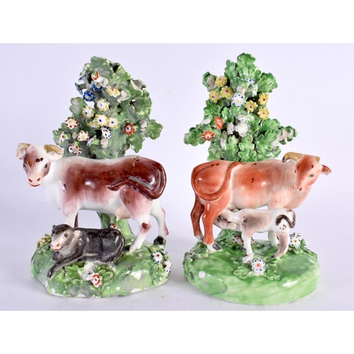 212 - 18th century pair of Derby cow groups standing before a brocage. 15cm high. (2)