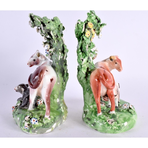 212 - 18th century pair of Derby cow groups standing before a brocage. 15cm high. (2)