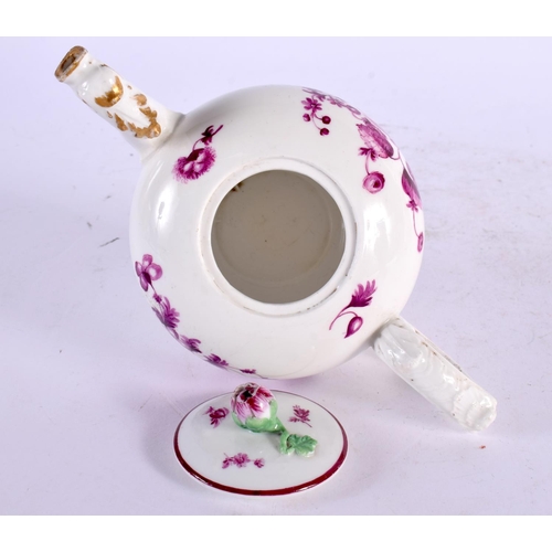 22 - AN 18TH CENTURY GERMAN PORCELAIN TEAPOT AND COVER painted with puce flowers. 17 cm wide.