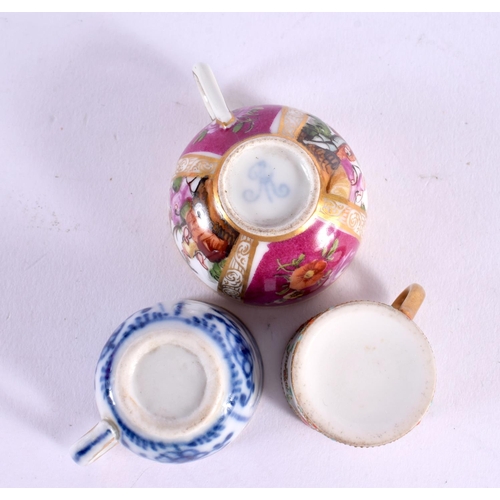 227 - Late 19th century two German miniature cups and saucers one with a Watteauesque panels and a small j... 