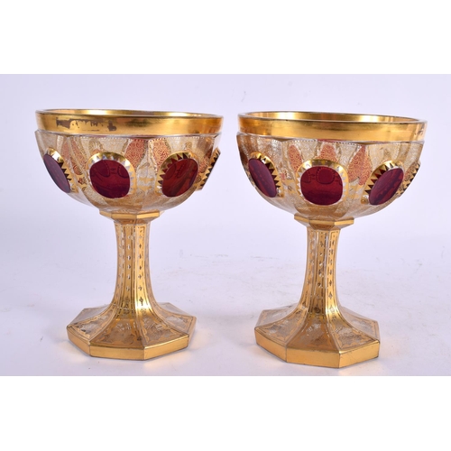 23 - A PAIR OF 19TH CENTURY BOHEMIAN GILT AND CRANBERRY GLASS GOBLETS bearing label to base Alexander I 1... 