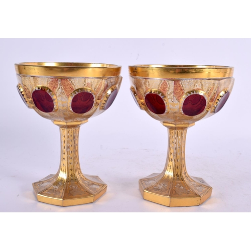 23 - A PAIR OF 19TH CENTURY BOHEMIAN GILT AND CRANBERRY GLASS GOBLETS bearing label to base Alexander I 1... 