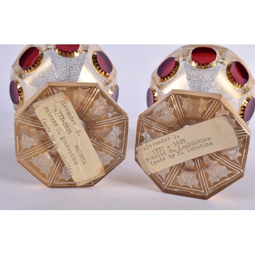 23 - A PAIR OF 19TH CENTURY BOHEMIAN GILT AND CRANBERRY GLASS GOBLETS bearing label to base Alexander I 1... 