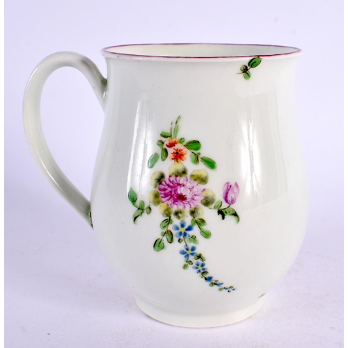 239 - 18th century Worcester bell shaped mug painted with three sprays of coloured flowers. 9cm high.