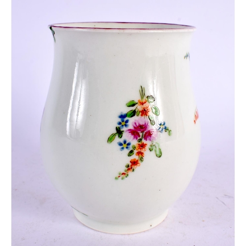 239 - 18th century Worcester bell shaped mug painted with three sprays of coloured flowers. 9cm high.