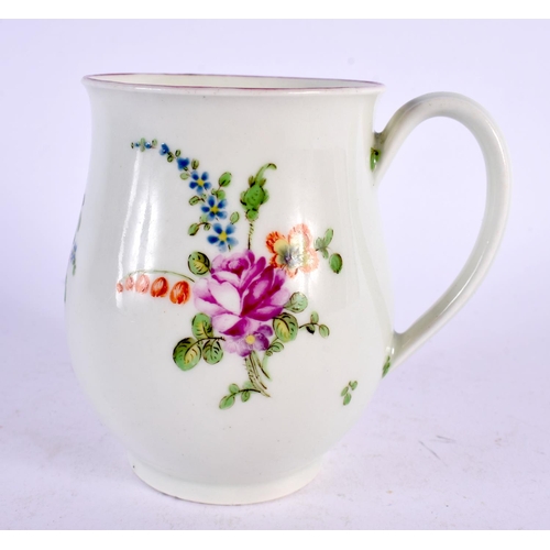 239 - 18th century Worcester bell shaped mug painted with three sprays of coloured flowers. 9cm high.