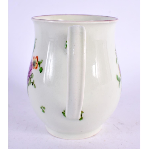 239 - 18th century Worcester bell shaped mug painted with three sprays of coloured flowers. 9cm high.